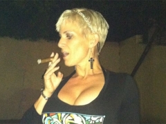Big tits enjoying a cigar