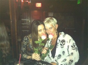 Two Girls Smelling Pink Roses